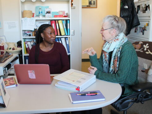 2023 predoctoral awardee Helen Omuya meets with her adviser.